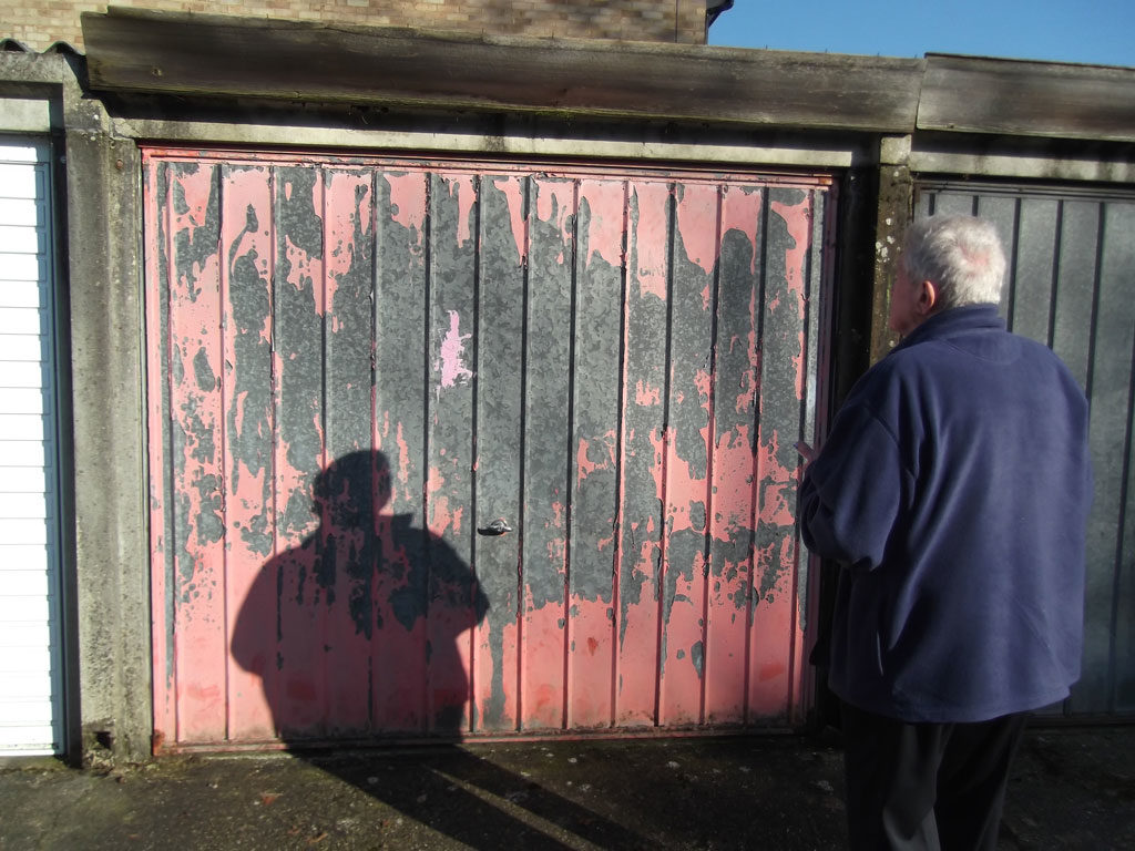 Battery Garage Refurbishment - Colin looking at 39 Rivermead before refurbishment