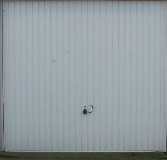 Security – As manufactured, up and over doors rely on rods actuated by a handle to enter sockets in the frame. This sounds secure enough but in reality it offers a low level of security. Security - As manufactured, up and over doors rely on rods actuated by a handle to enter sockets in the frame. This sounds secure enough but in reality it offers a low level of security.